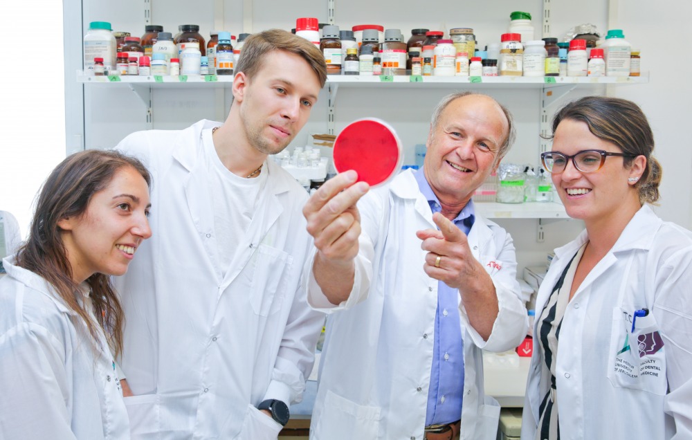 Researchers with orange plate