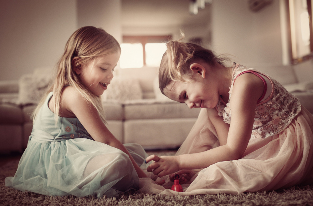 Twins painting nails