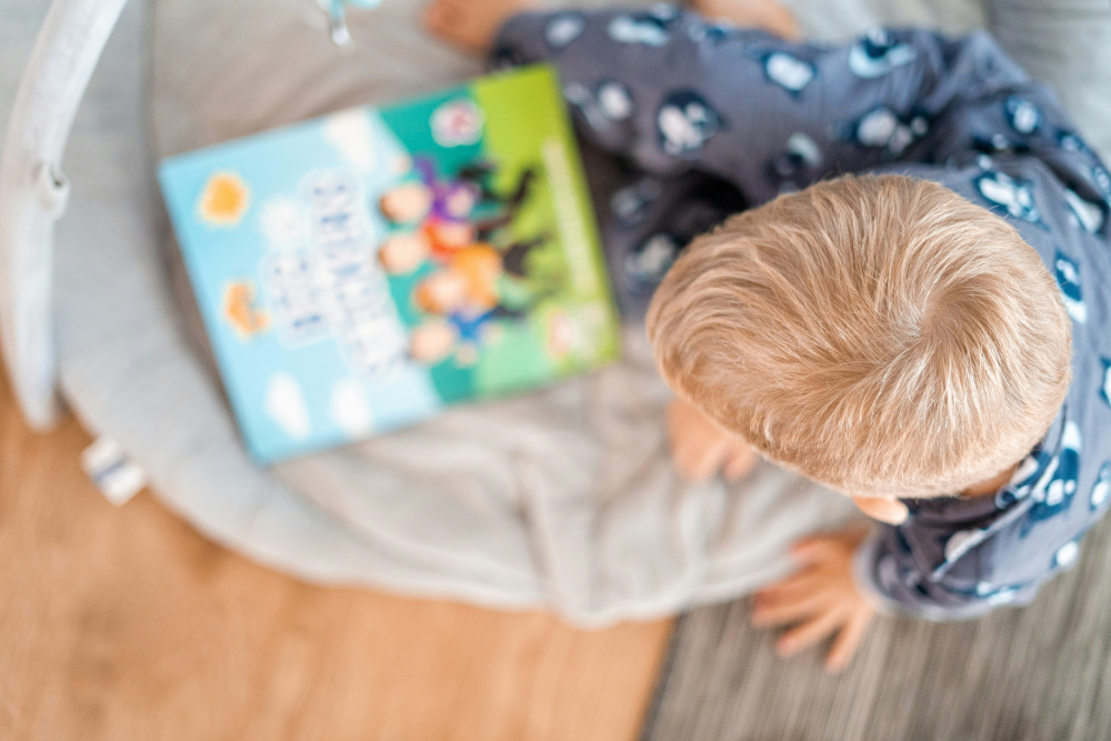 blond boy reading